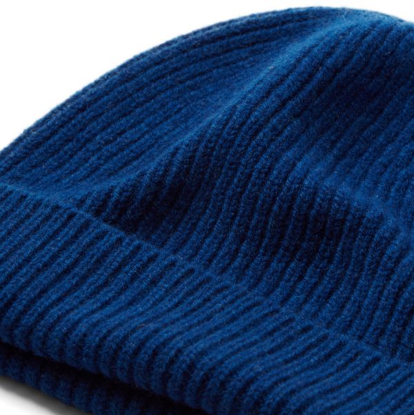 Blue ribbed knit beanie hat close up