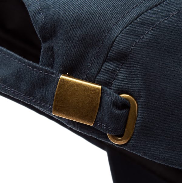 Back view close up of the fish shop navy blue cap with brass adjuster