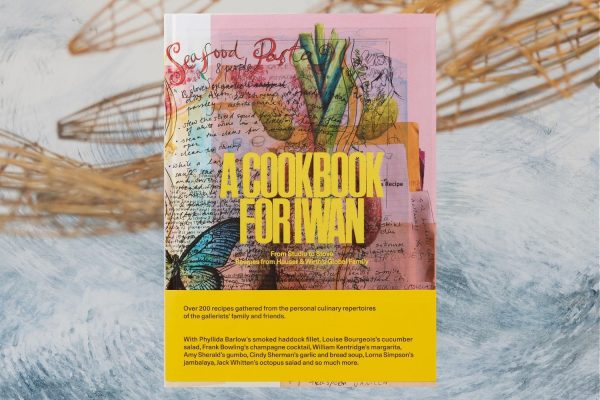 A cookbook cover on. a background of a painted ocean